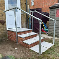 Disabled Handrails Alongside Steps to Back Door of Home by JMC Services