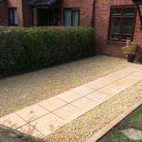 New front garden area with slabs decorative chippings and clay pave surround