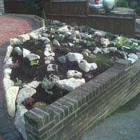 Corner rockery including new plants