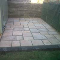 Small random pattern patio alongside a new summer house