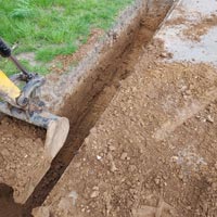 Excavating Hole with Mini Digger - Sustainable Drainage System by JMC Services